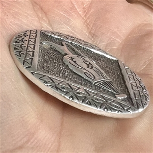 Aluminum button of a vase.