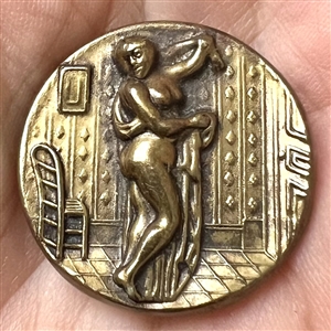 “After the bath” brass button of woman.