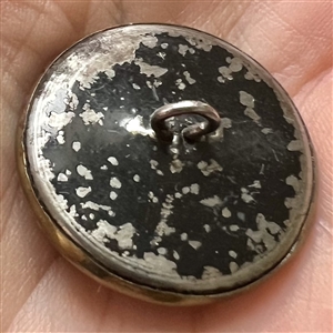 “After the bath” brass button of woman.