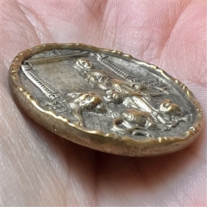 “Lion tamer” brass button of a woman with lions.