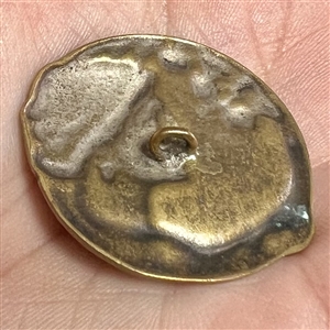 Art Nouveau brass button of a woman with verbal “Terre (earth) by Armond Bargas.