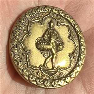 Unusual brass button of a man carrying baskets.