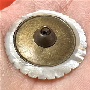An 18th c. Carved pearl button with paste center. 