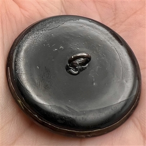 “Sleeping watchman” tinted brass button.