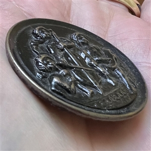 “Child musicians” tinted brass button.