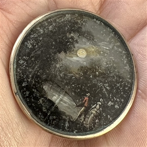 An 18th c. Painting under glass button of an unusual night scene.