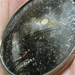 An 18th c. Painting under glass button of an unusual night scene.