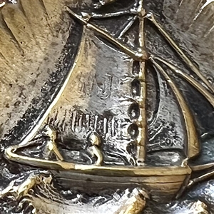 “Sailboat in a Shell” brass button.