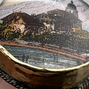 Reverse-painted architectural scene under glass set in gilded metal button.