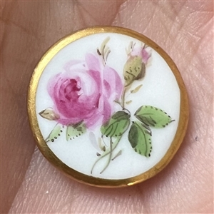 An 18th c. Dresden porcelain button of a rose.