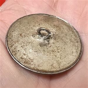 A 19th c. Gold luster painted carnation on white ceramic button.