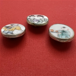 Three shard ceramic buttons of Asian children.