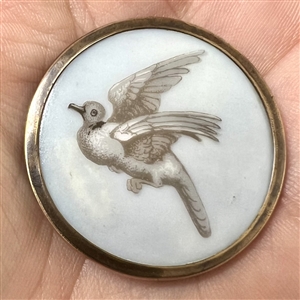 A 19th c. Liverpool transfer button of dove in flight.