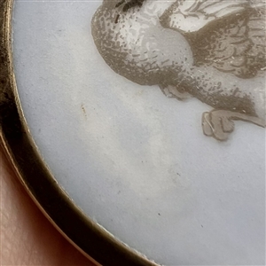 A 19th c. Liverpool transfer button of dove in flight.