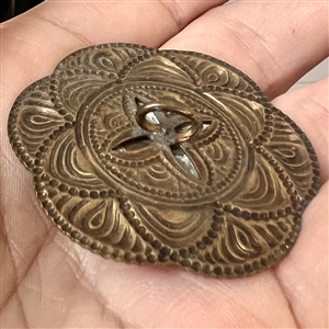Carved wood deer set in metal button. 