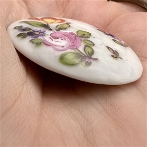 Transitional Mennecy (?) porcelain button of flowers.