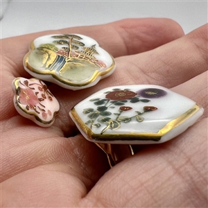 Three lovely Japanese Kutani porcelain  buttons in interesting shapes.