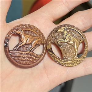 Two Vintage celluloid buttons of mountain goats.