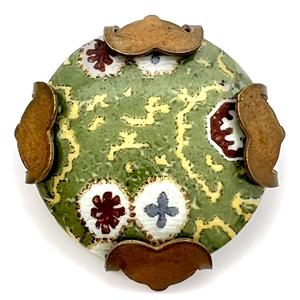 Painted porcelain button set in an unusual brass “spider."