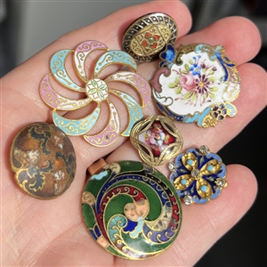 Seven assorted enamel buttons. 