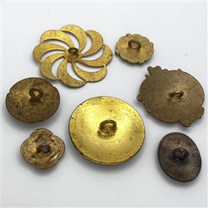 Seven assorted enamel buttons. 