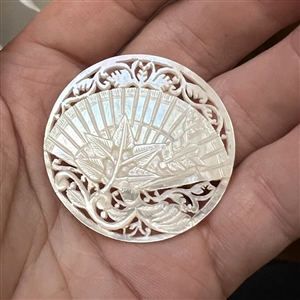 Bethlehem pearl button of a fan and flora elements.