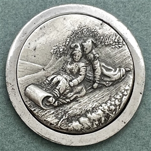 “Toboggan Ride" pewter set in steel-cup button.