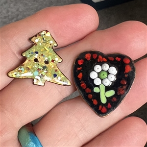 Two studio enamel buttons by Herman Lowenstein.