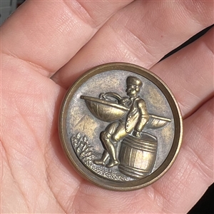 SCARCE “Fish Peddler Boy brass button.