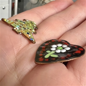 Two studio enamel buttons by Herman Lowenstein.