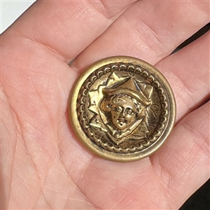 Brass “Simple Simon nursery rhyme button. 