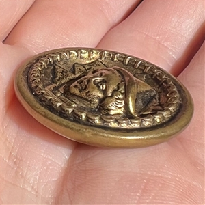 Brass “Simple Simon nursery rhyme button. 