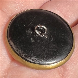 Brass “Simple Simon nursery rhyme button. 