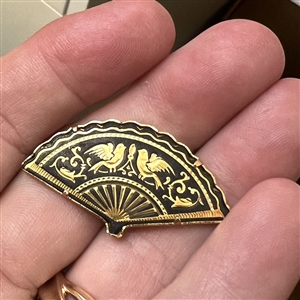 Damascene button of realistic fan. 