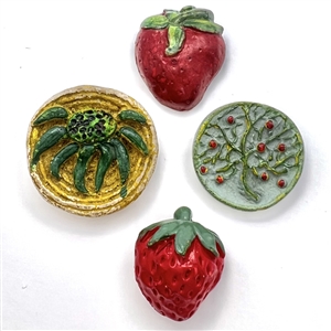 Four painted plaster buttons. 