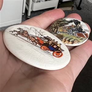 Two studio ceramic buttons of transportation. 