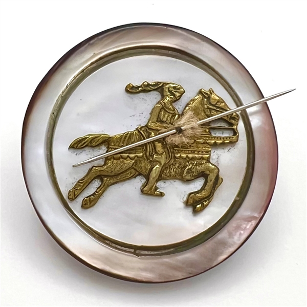 UNIQUE studio button of a jousting knight with a sewing needle lance by Tom Maringer. 