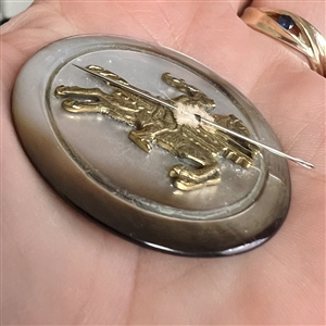 UNIQUE studio button of a jousting knight with a sewing needle lance by Tom Maringer. 