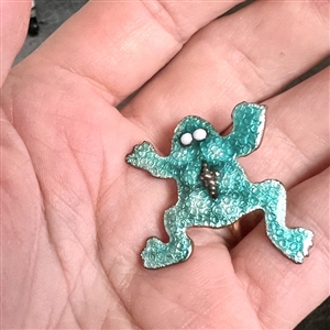 Ginbari foil enamel studio button by Karen Cohen of a frog.