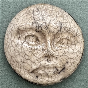 “Moon Face" ceramic studio button.