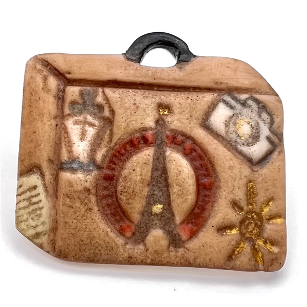 Ceramic studio button of a travel bag - favor button for FSBS 2011.