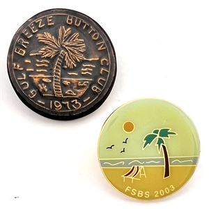 Two show favor buttons with palm trees.