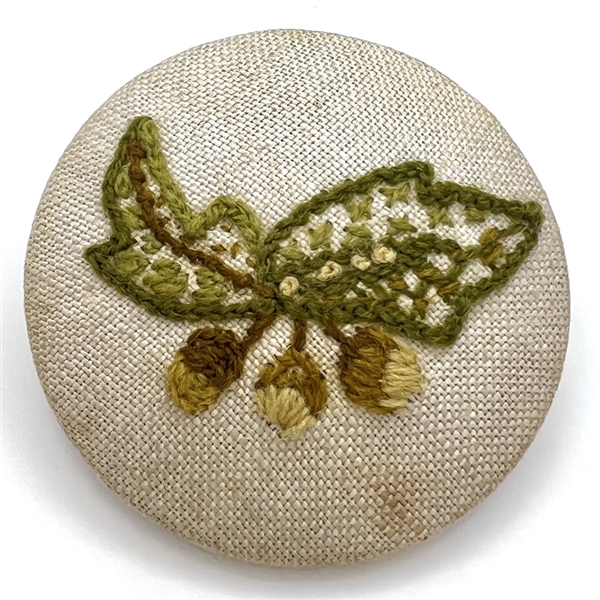 Huge embroidered studio button of leaves and berries by Patricia Hurlin. 