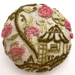 Huge embroidered studio button of fairy house in a flower garden by Marie Boorum. 