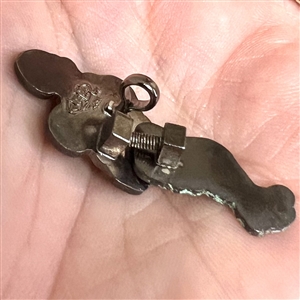 Movable cold enamel button of a flapper.