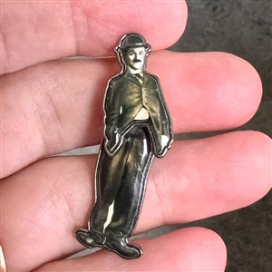 Movable cold enamel button of a Charlie Chaplin. 