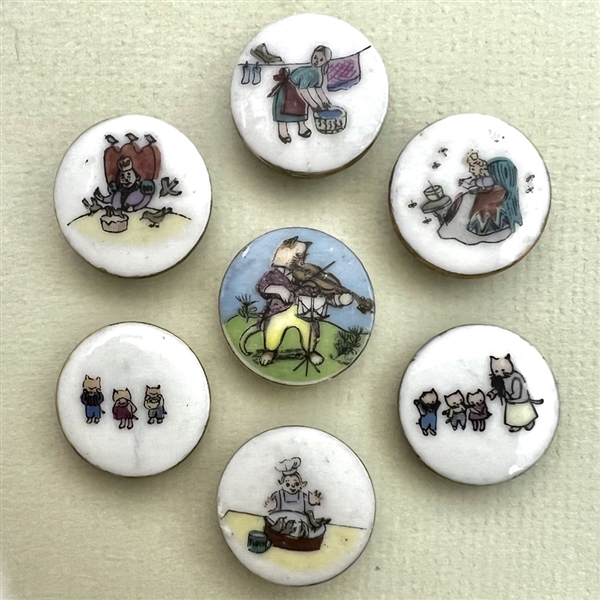 Seven porcelain nursery rhyme buttons by Lois Calkins. 