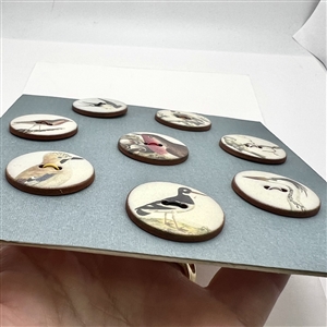 Card of eight ceramic bird buttons handmade by Stockwell Ceramics. 