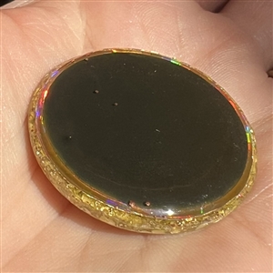Card of five astronomical buttons including Nancy Dubois hologram crescent man in the moon.