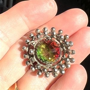 Very unusual multi-colored flashed glass set in metal “wheels button.